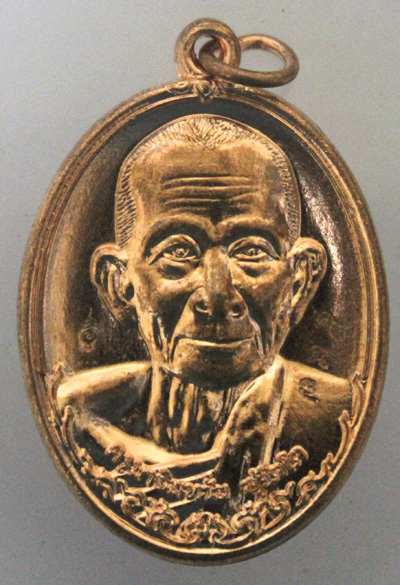 เหรียญทองแดงผิวไฟรุ่นแรกครูบาอินหวัน สุจิตโต วัดหล่าย อ.ภูซาง จ.พะเยา เบอร์ ๕๙๗