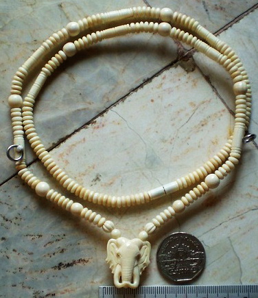  งาช้างแท้่ ใช้แว่นโอนัท 5.5 มิล งาประคำ 7 มิล ห่วงกลางหัวช้าง แกะจากงาช้างทั้งชิ้น ความยาว 25 นิ้ว